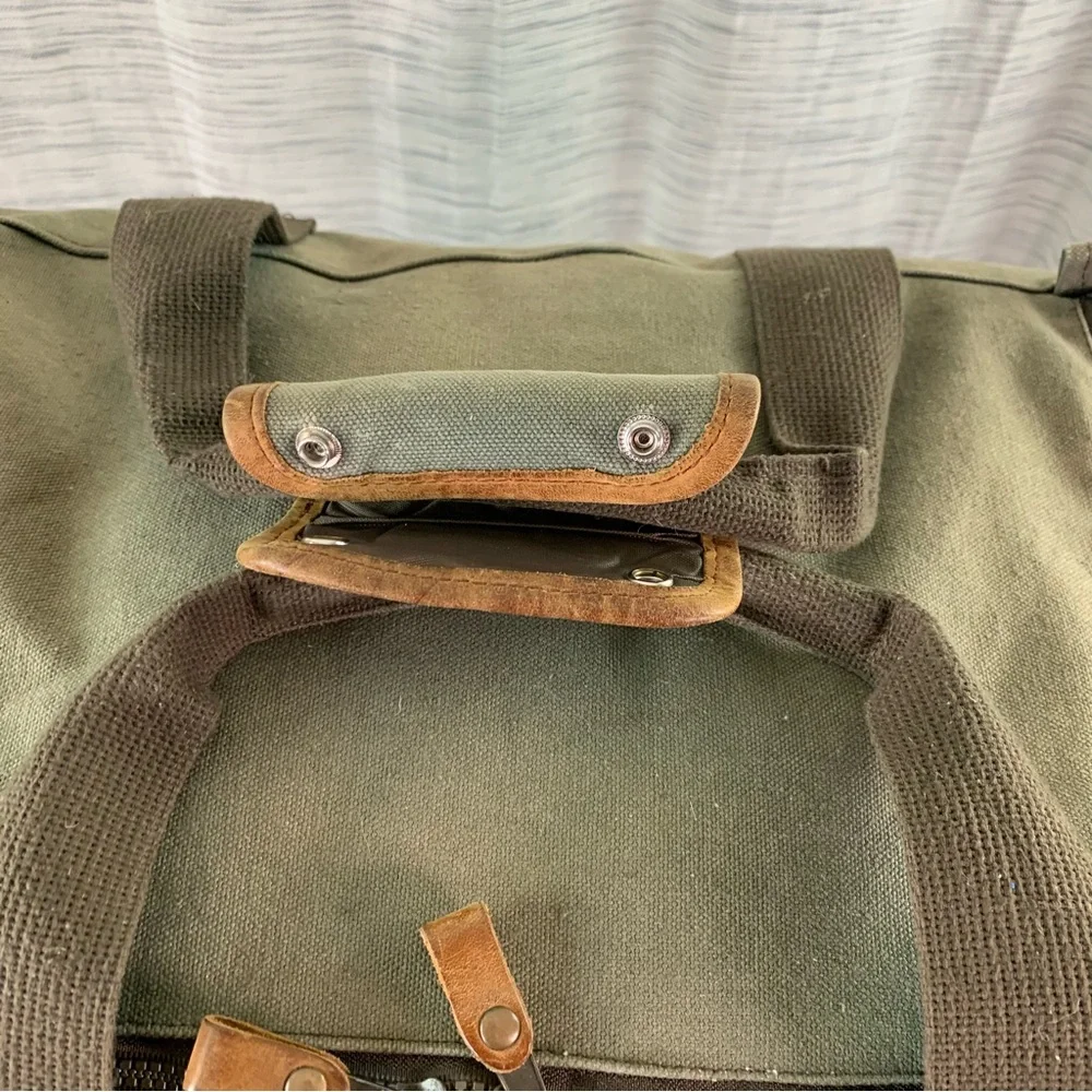 High Sierra Green canvas and Brown leather Duffel Bag.